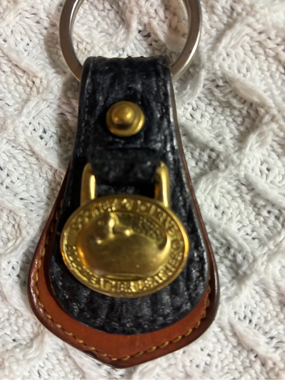 Dooney & Bourke Black and Brown Leather Key Fob with Gold Medallion